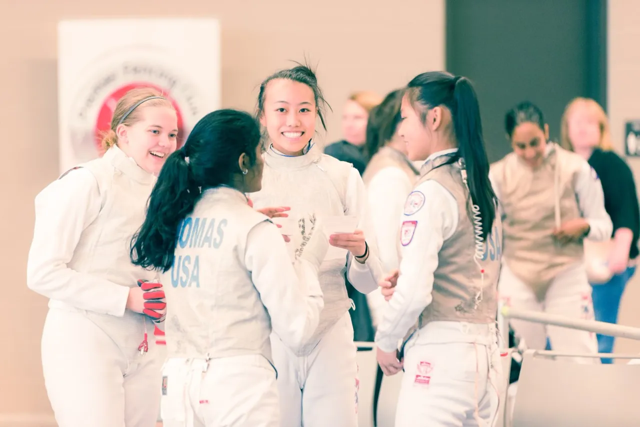 Fencers connecting at a competition